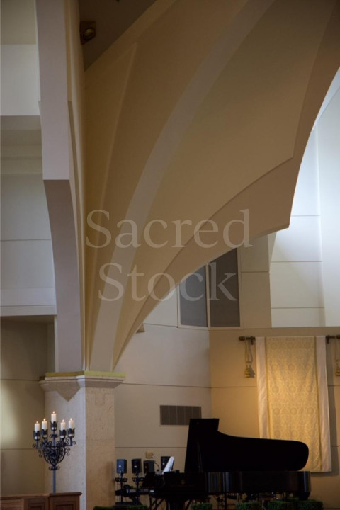 Arch with piano and candelabra